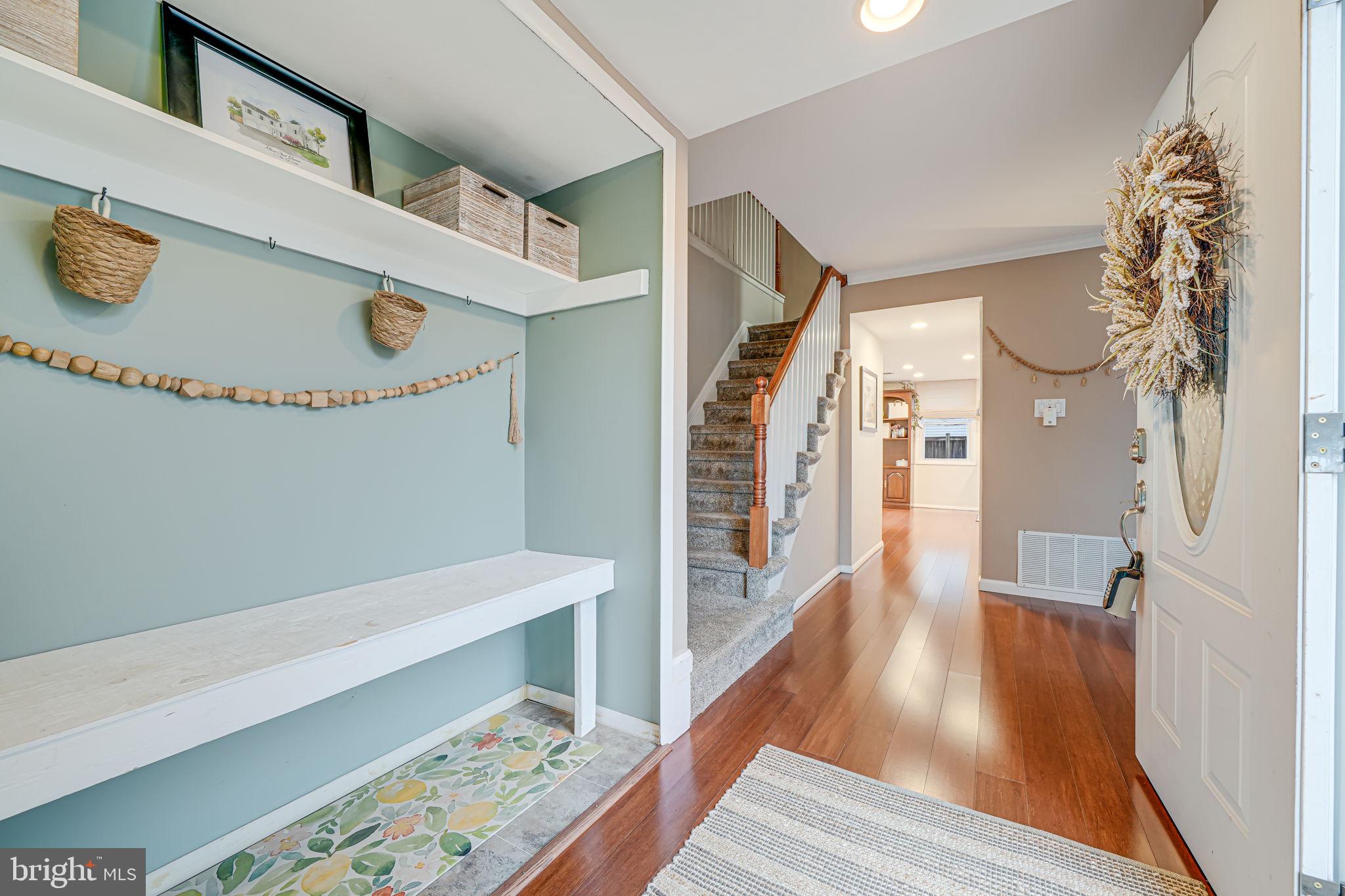 116 Elm Tree Lane Sterling, VA 20164 - Photo 3 of 56 a view of hallway with furniture and wooden floor