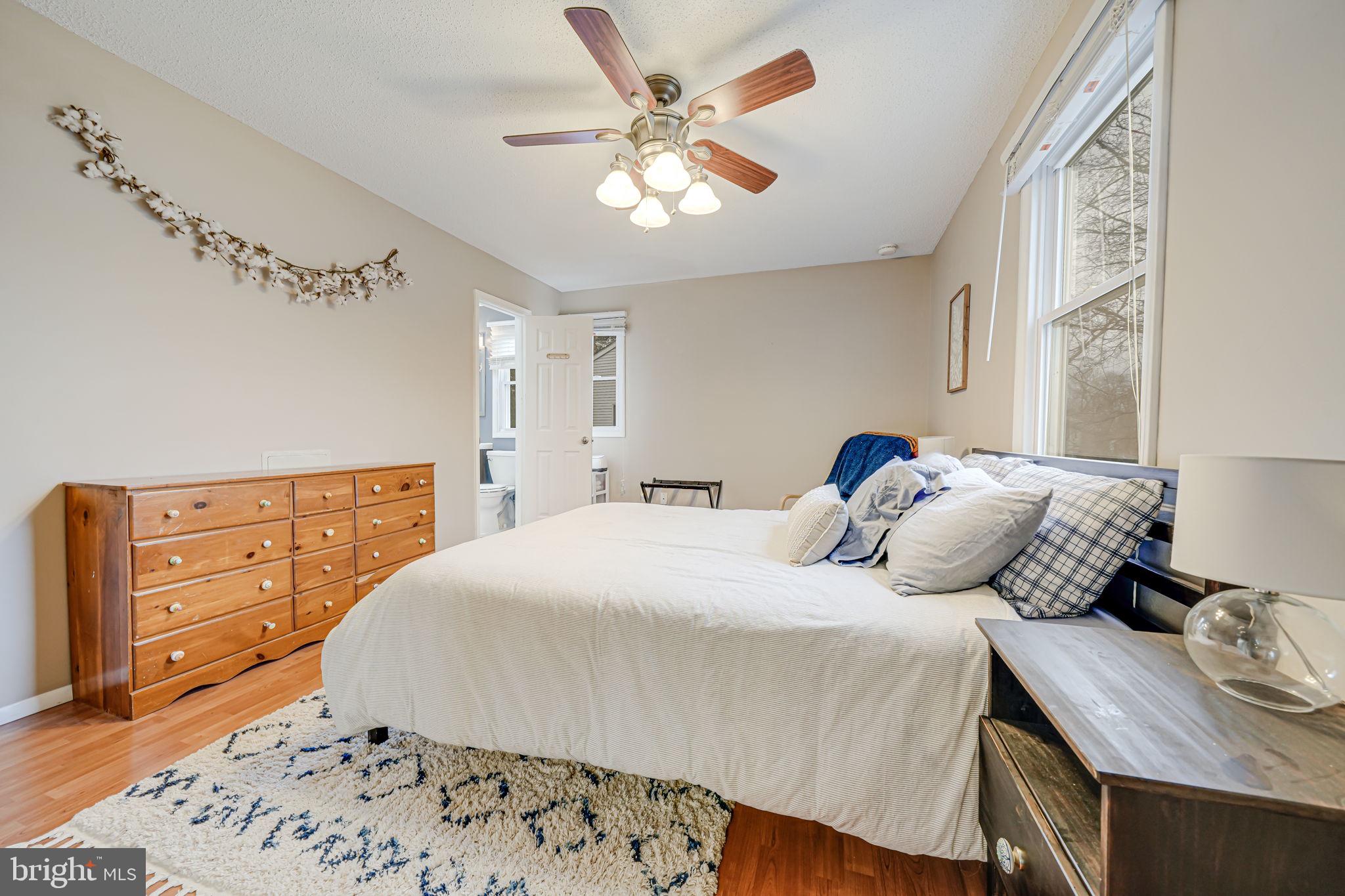116 Elm Tree Lane Sterling, VA 20164 - Photo 38 of 56 a bedroom with a bed and a dresser