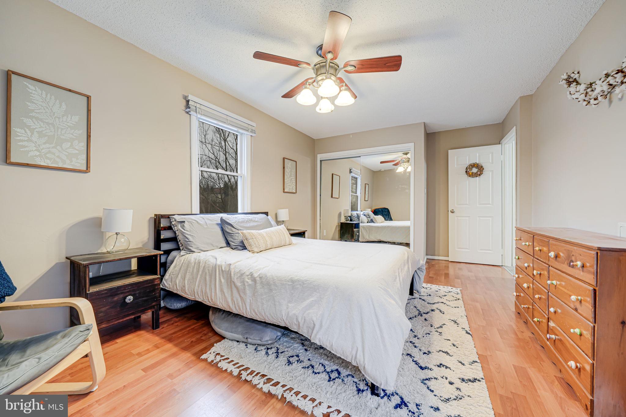 116 Elm Tree Lane Sterling, VA 20164 - Photo 39 of 56 a spacious bedroom with a bed and a chandelier