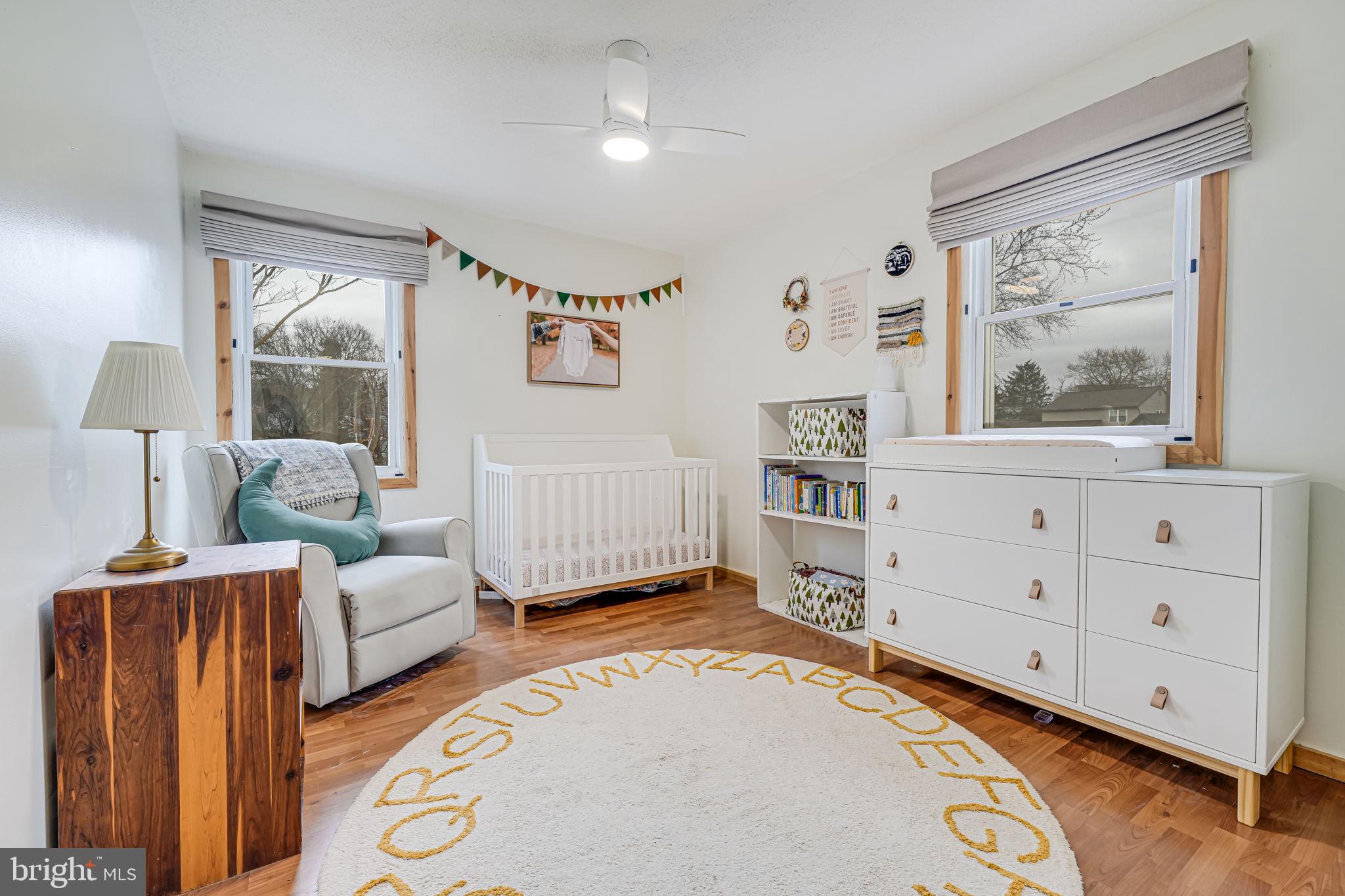 116 Elm Tree Lane Sterling, VA 20164 - Photo 41 of 56 a living room with furniture and a window