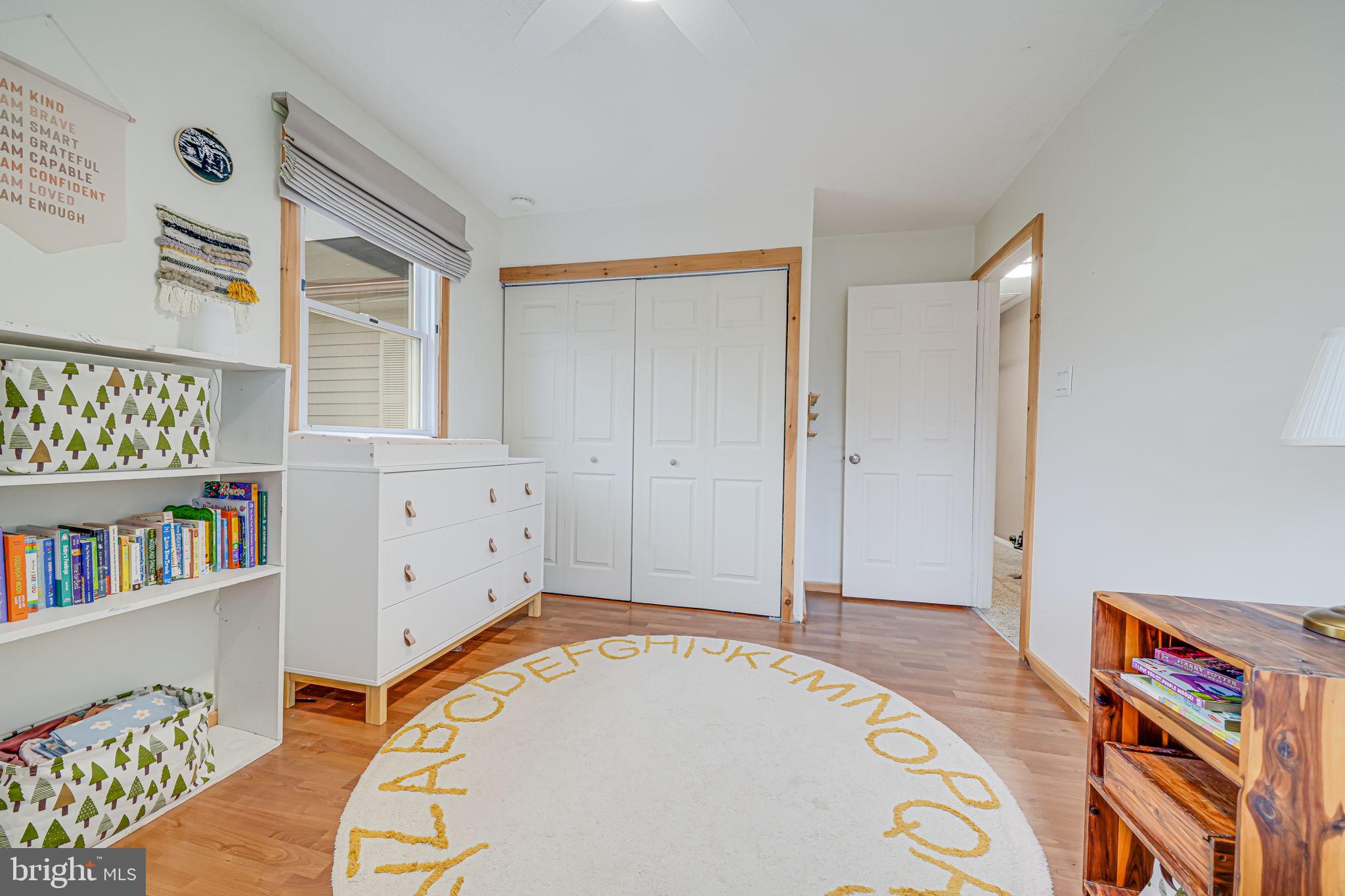116 Elm Tree Lane Sterling, VA 20164 - Photo 42 of 56 a view of an empty room with window and book shelf