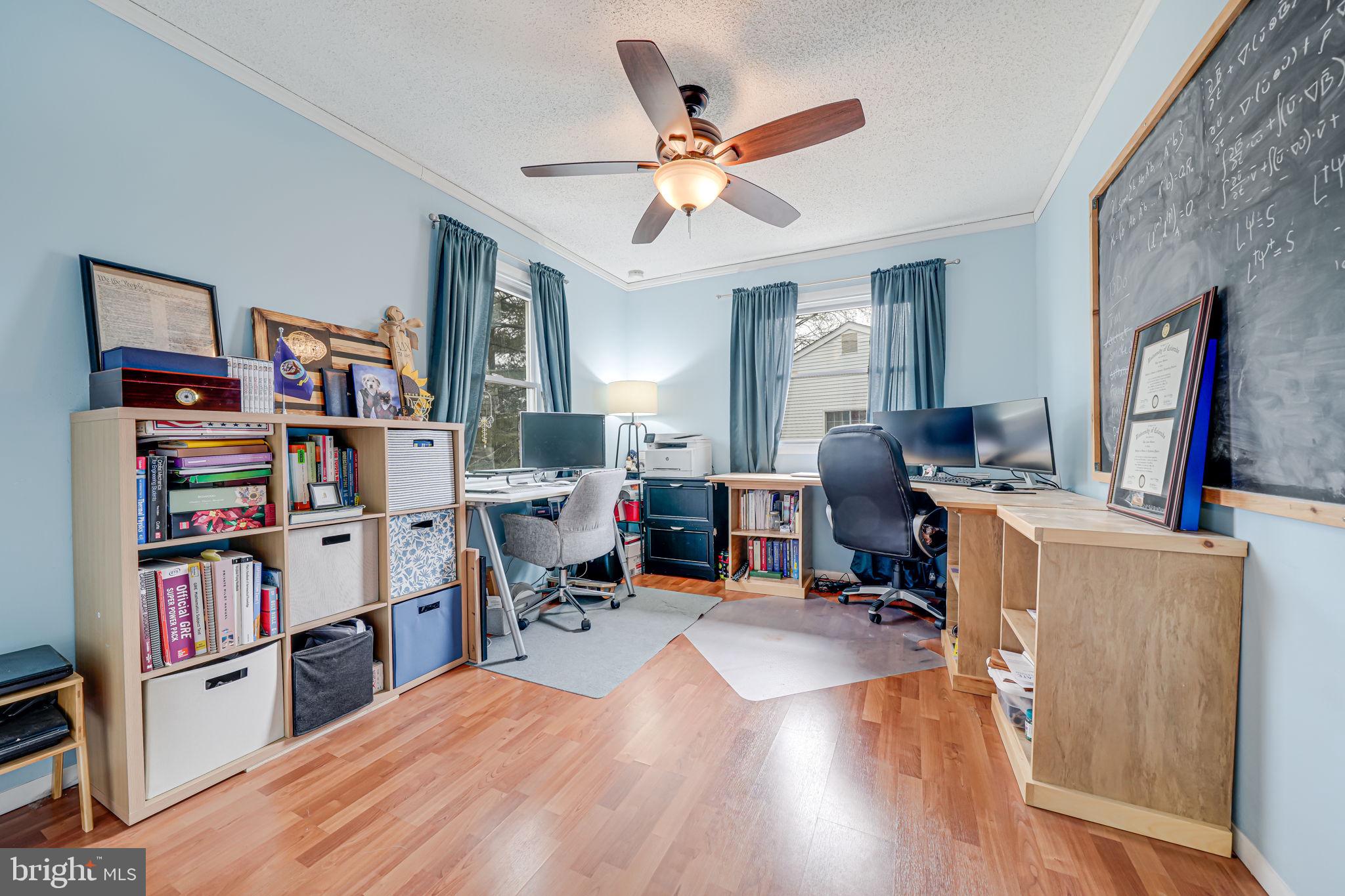 116 Elm Tree Lane Sterling, VA 20164 - Photo 44 of 56 a bed room with a bed and a book shelf