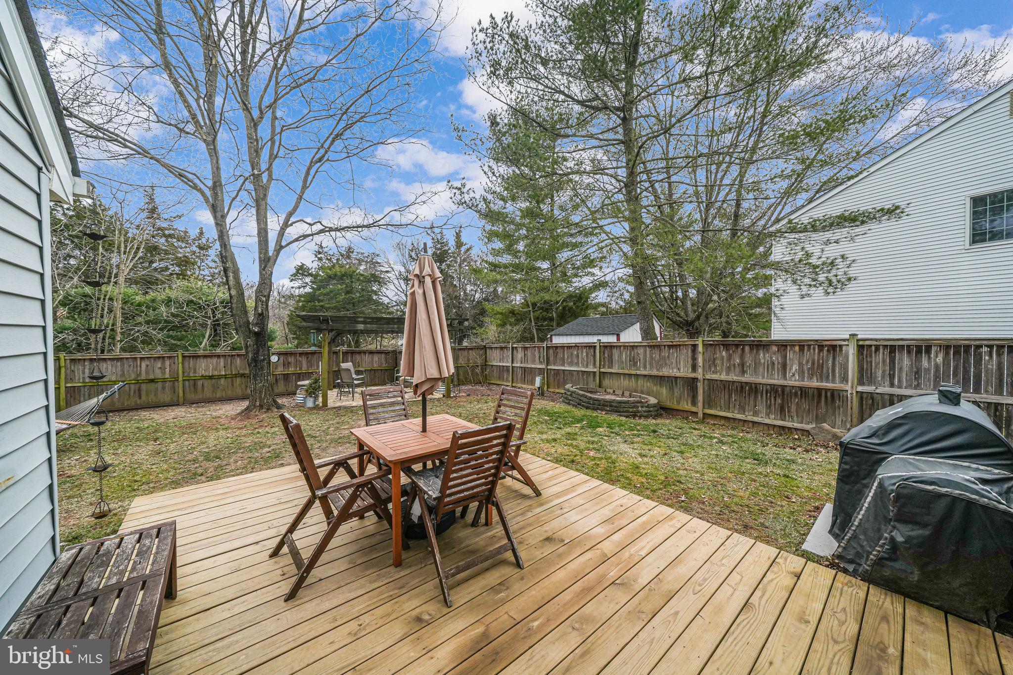 116 Elm Tree Lane Sterling, VA 20164 - Photo 46 of 56 a view of a wooden deck with furniture