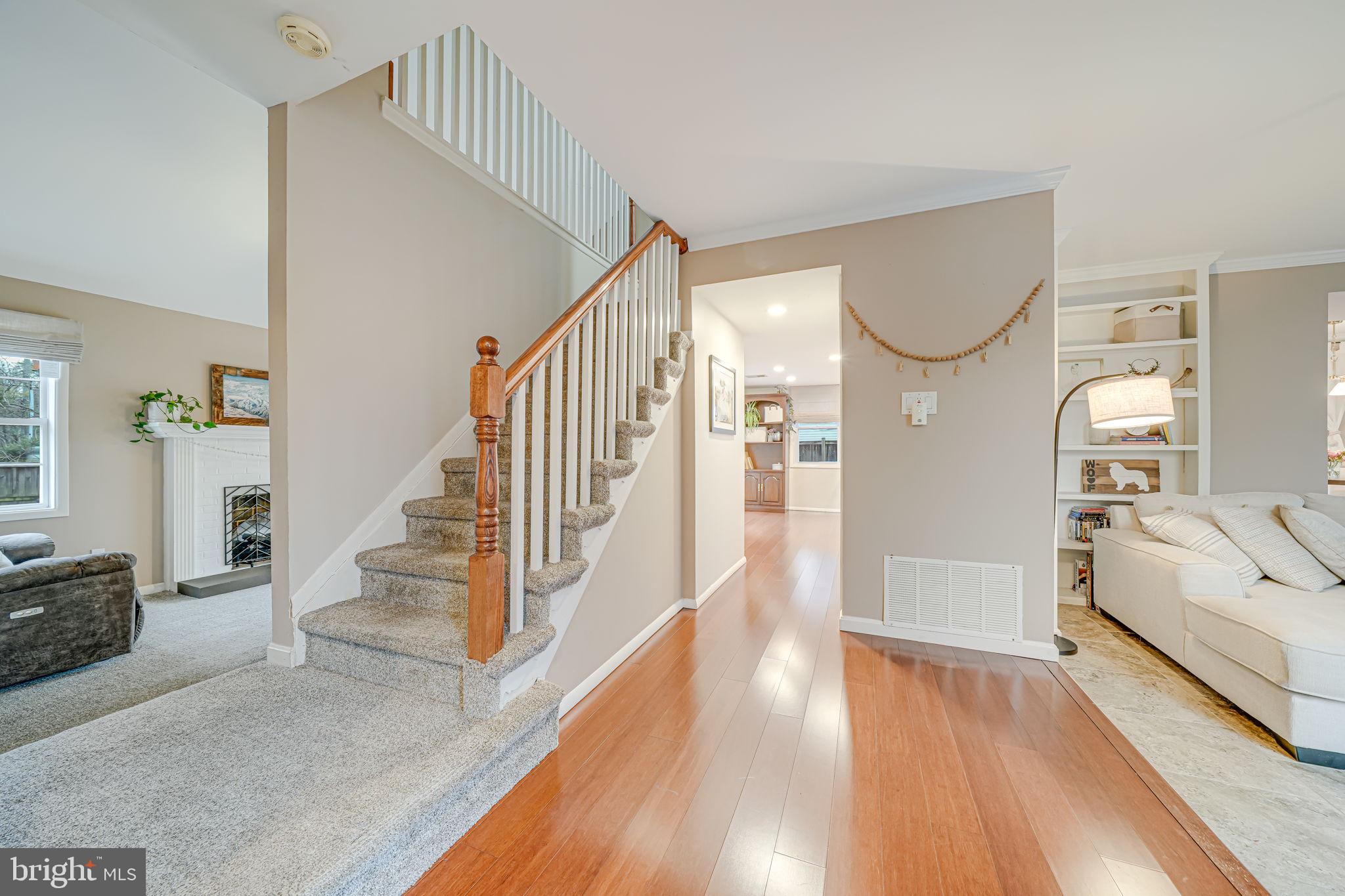 116 Elm Tree Lane Sterling, VA 20164 - Photo 5 of 56 a view of entryway and hall with wooden floor