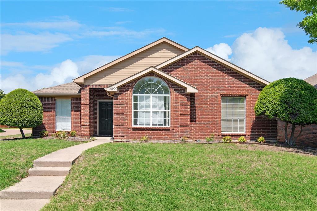 10900 Trestles Road Frisco, TX 75035 - Photo 1 of 1 front view of a house with a yard