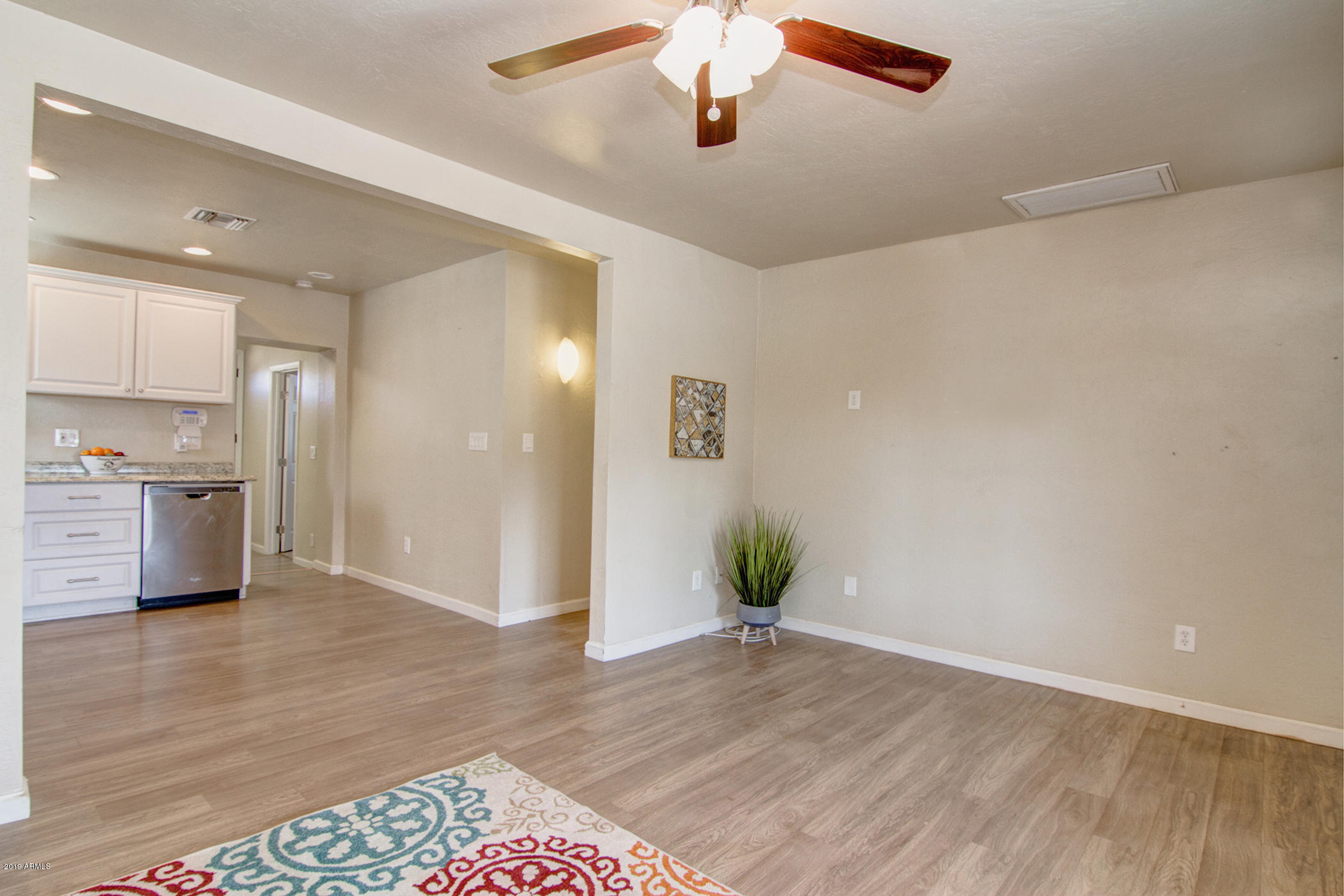 1124 West Mountain View Road Phoenix, AZ 85021 - Photo 5 of 25 a view of kitchen with cabinets and wooden floor