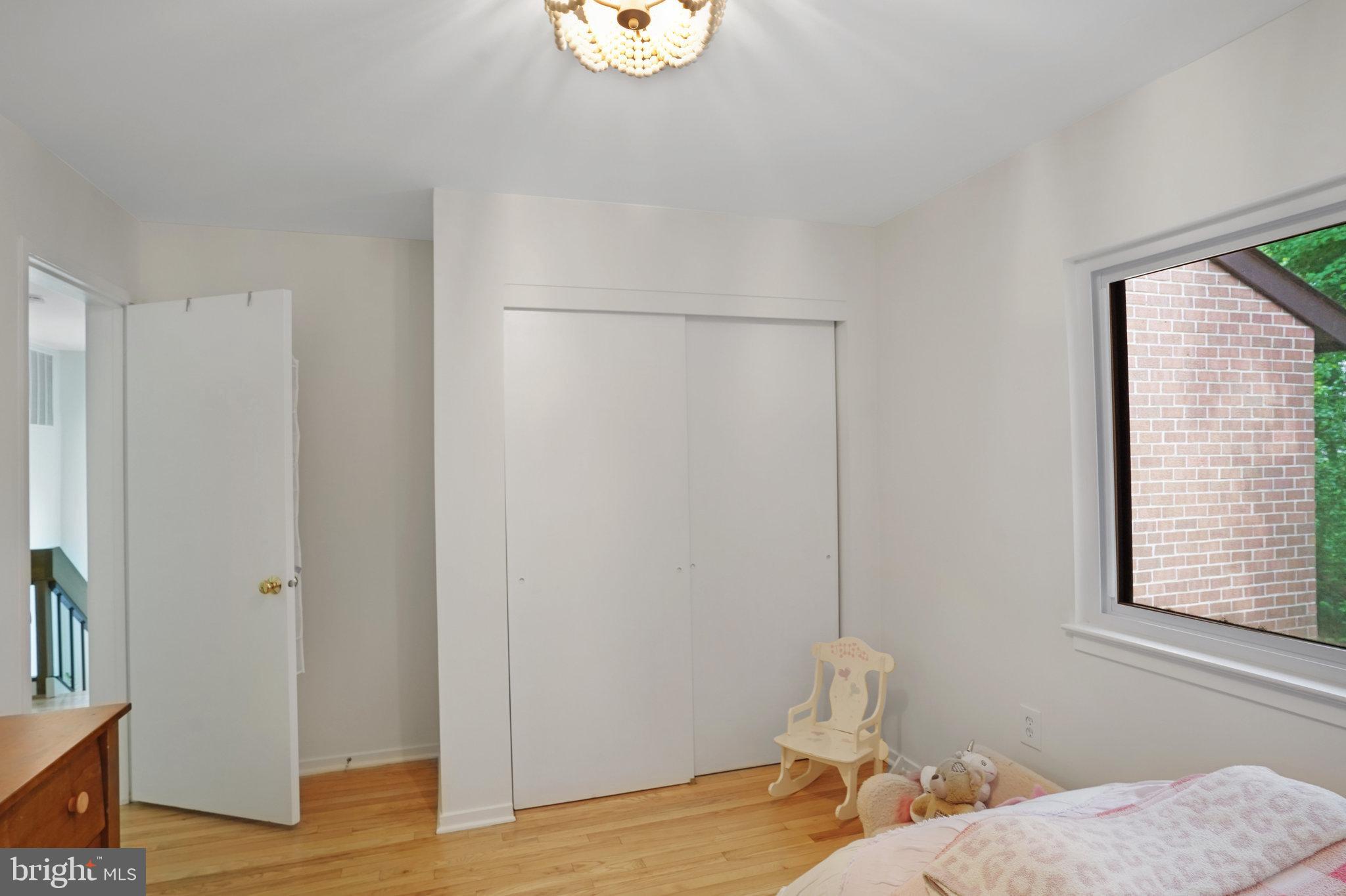 11784 Indian Ridge Road Reston, VA 20191 - Photo 25 of 44 a bedroom with a bed and a window