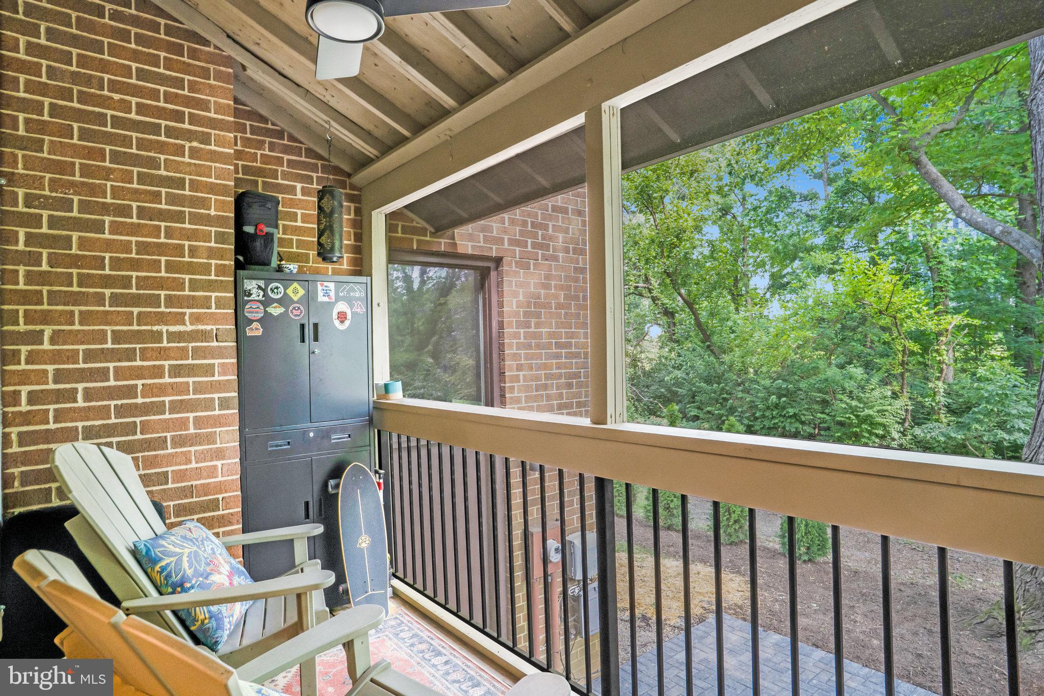 11784 Indian Ridge Road Reston, VA 20191 - Photo 33 of 44 a view of a balcony with chair and wooden floor