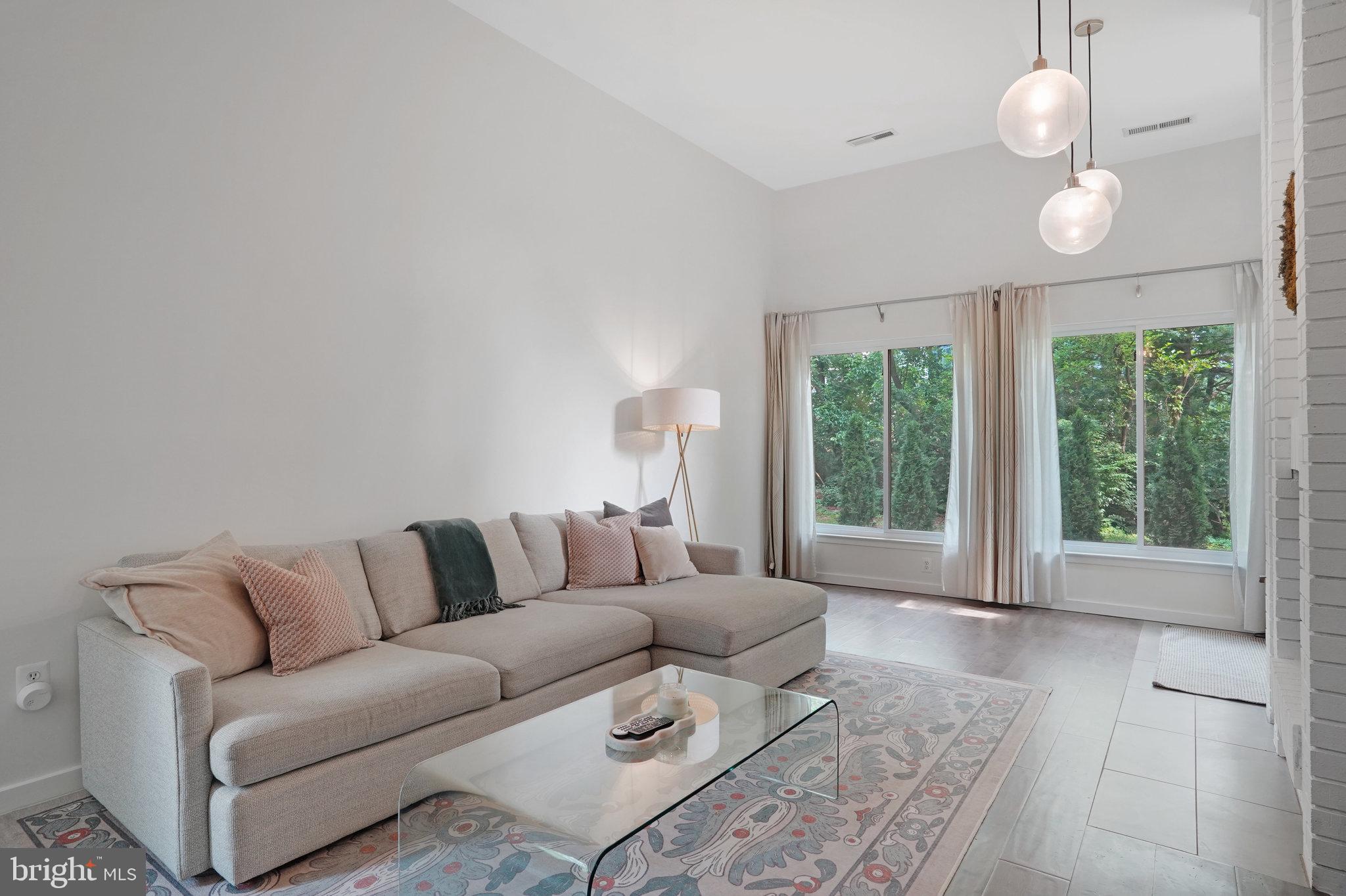 11784 Indian Ridge Road Reston, VA 20191 - Photo 8 of 44 a living room with furniture and a large window