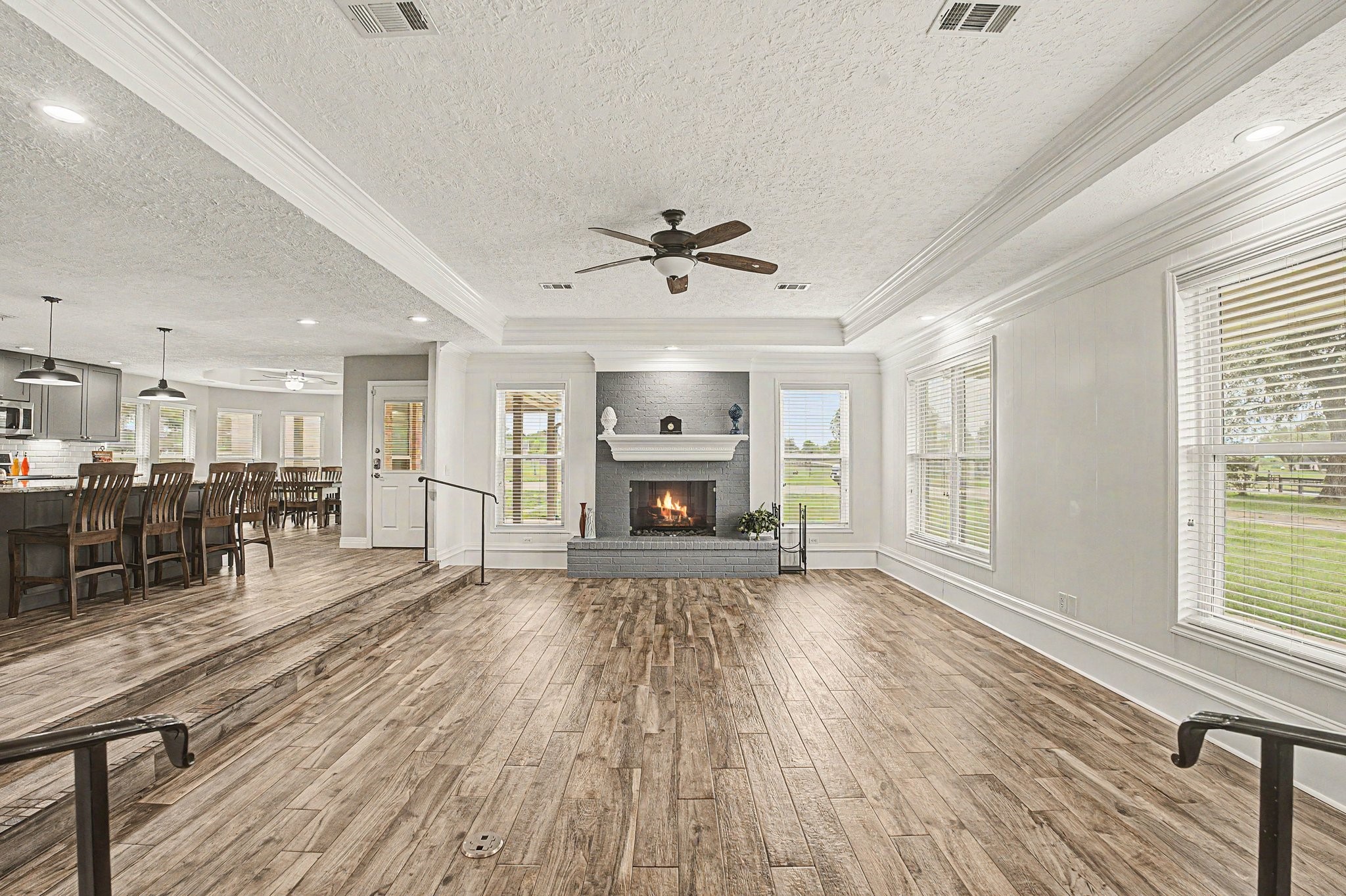 35564 Brumlow Road Hempstead, TX 77445 - Photo 5 of 46 a view of an empty room with a fireplace and wooden floor
