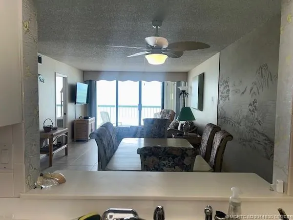 a kitchen that has a refrigerator and a stove