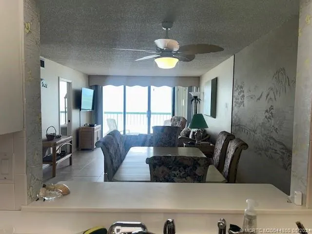 a kitchen that has a refrigerator and a stove