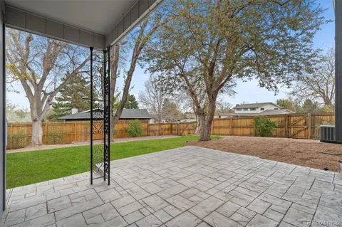 a view of backyard with large tree