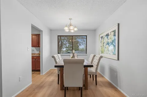a dining room with furniture window wooden floor