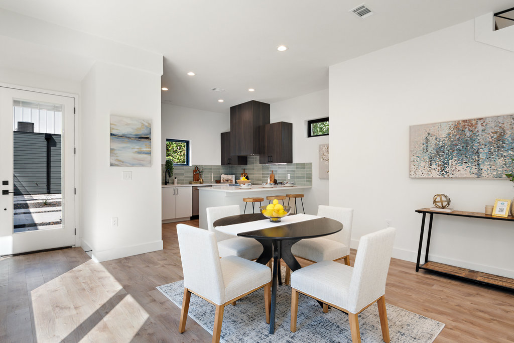 4407 Merle Drive, Unit B Austin, TX 78745 - Photo 13 of 38 a kitchen with a dining table chairs and refrigerator