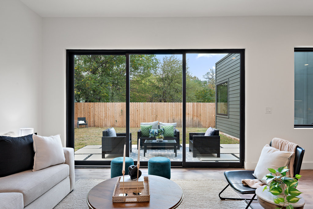 4407 Merle Drive, Unit B Austin, TX 78745 - Photo 16 of 38 a living room with furniture and a large window