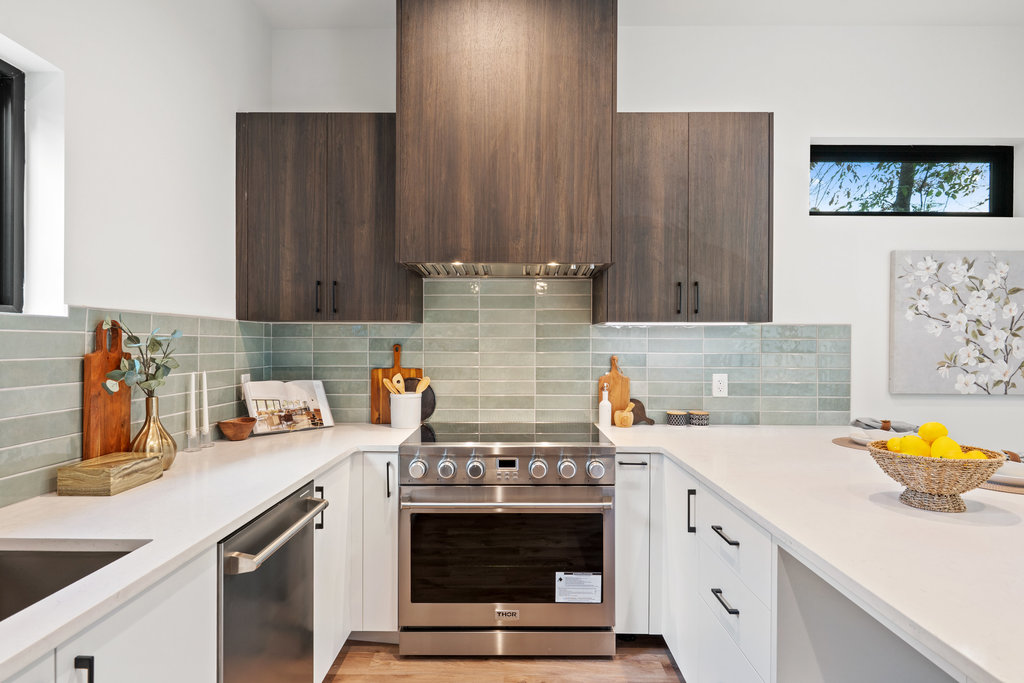 4407 Merle Drive, Unit B Austin, TX 78745 - Photo 2 of 38 a kitchen with a stove and a sink