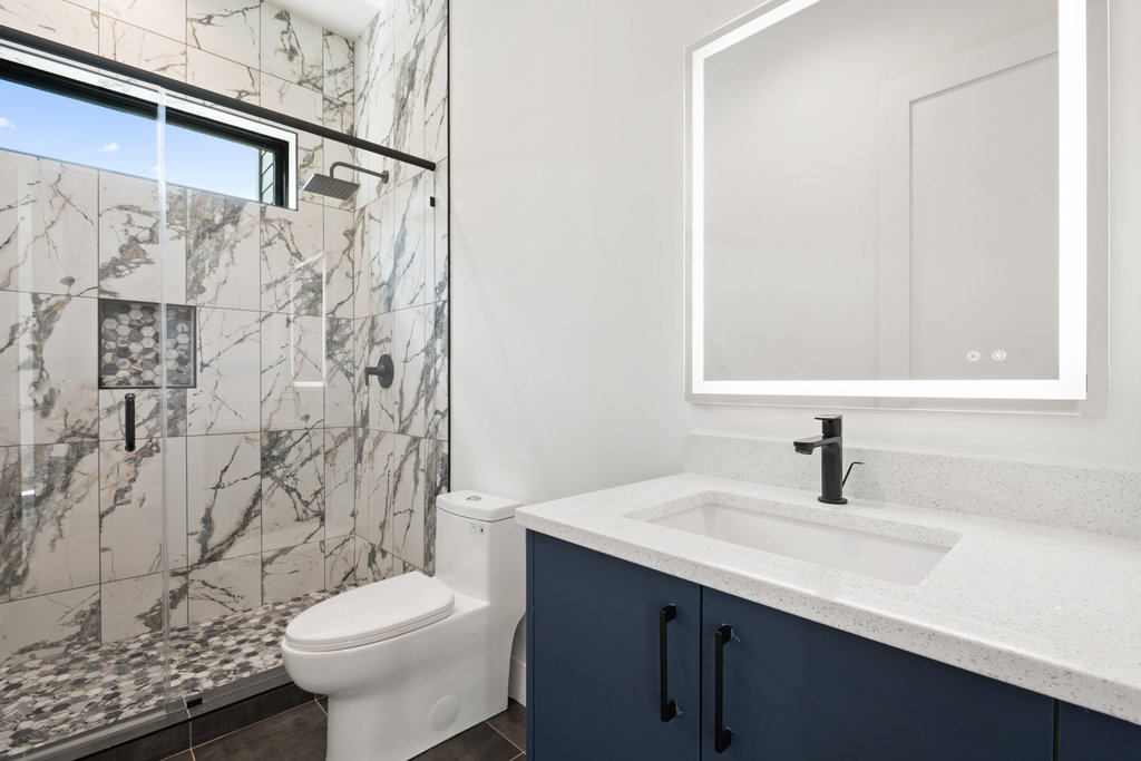 4407 Merle Drive, Unit B Austin, TX 78745 - Photo 27 of 38 a bathroom with a sink toilet and shower