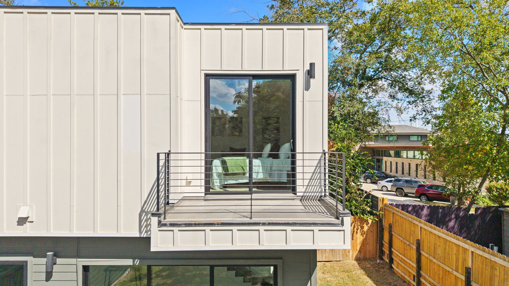 4407 Merle Drive, Unit B Austin, TX 78745 - Photo 35 of 38 a view of backyard with barbeque grill and wooden fence
