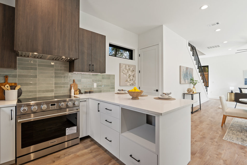 4407 Merle Drive, Unit B Austin, TX 78745 - Photo 9 of 38 a kitchen with a stove and a sink