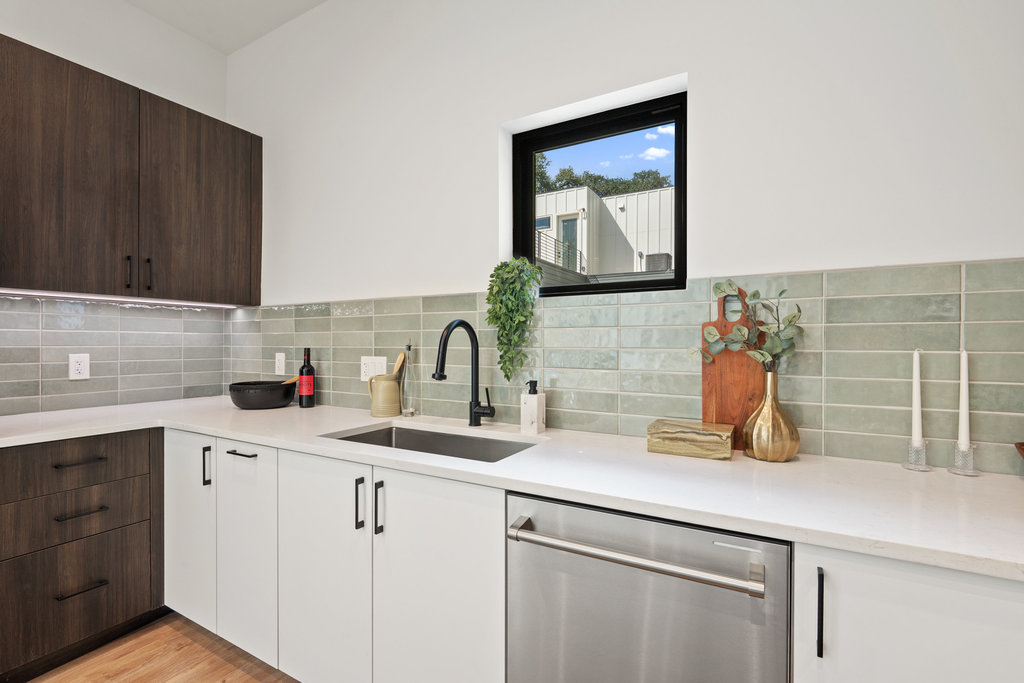 4407 Merle Drive, Unit B Austin, TX 78745 - Photo 10 of 38 a kitchen with appliances a sink and cabinets
