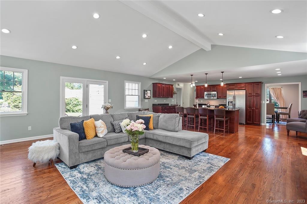 175 Farist Road Fairfield, CT 06825 - Photo 1 of 1 a living room with furniture and wooden floor