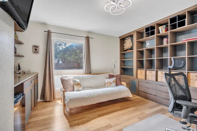 a bedroom with a bed furniture and a window