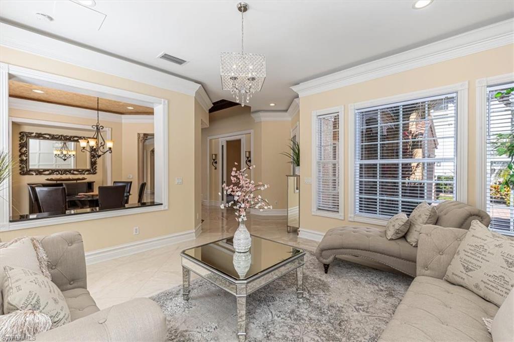 2135 Par Drive Naples, FL 34120 - Photo 12 of 49 a living room with furniture and a large window