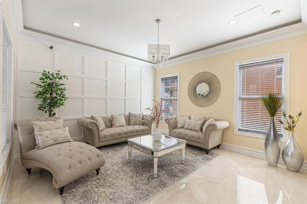 2135 Par Drive Naples, FL 34120 - Photo 13 of 49 a living room with furniture and a large window