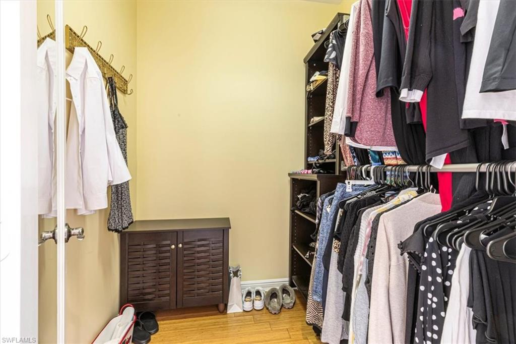 2135 Par Drive Naples, FL 34120 - Photo 26 of 49 a view of walk in closet with clothes and shoes