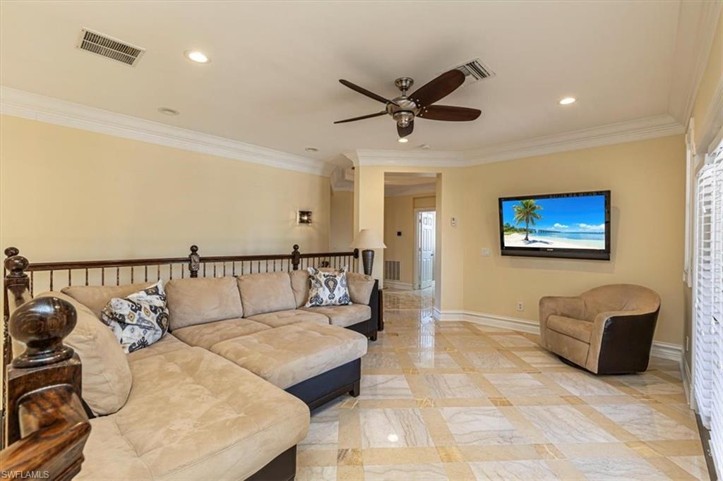 2135 Par Drive Naples, FL 34120 - Photo 29 of 49 a bed room with furniture and a ceiling fan