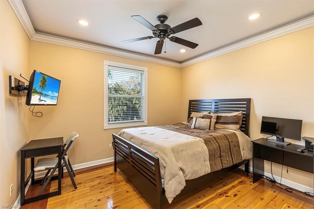 2135 Par Drive Naples, FL 34120 - Photo 31 of 49 a bedroom with a bed and a desk