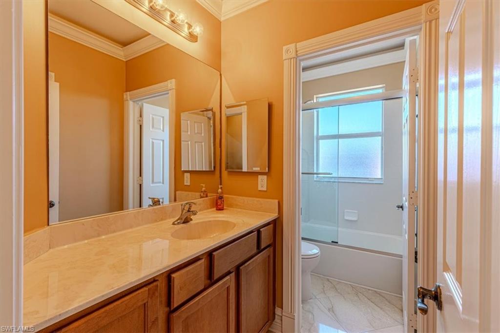 2135 Par Drive Naples, FL 34120 - Photo 33 of 49 a bathroom with a sink a toilet and a shower