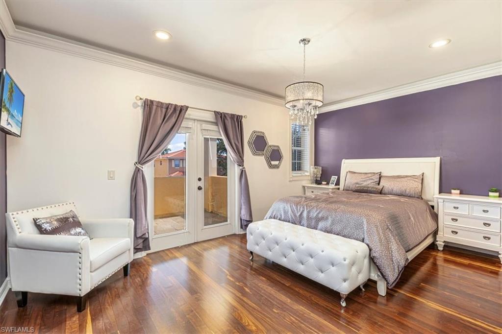 2135 Par Drive Naples, FL 34120 - Photo 35 of 49 a spacious bedroom with a bed and a couch