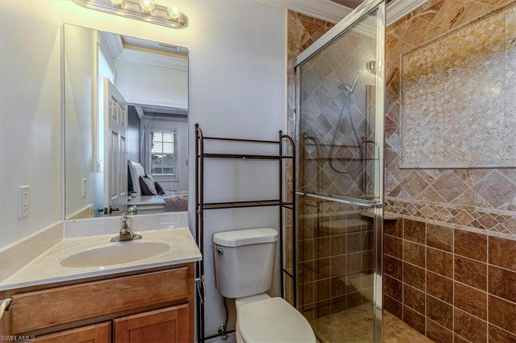 2135 Par Drive Naples, FL 34120 - Photo 38 of 49 a bathroom with a sink toilet and shower