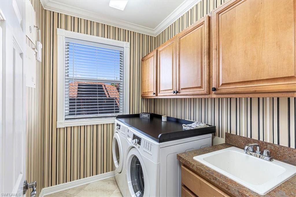 2135 Par Drive Naples, FL 34120 - Photo 42 of 49 a kitchen that has a sink and a stove in it