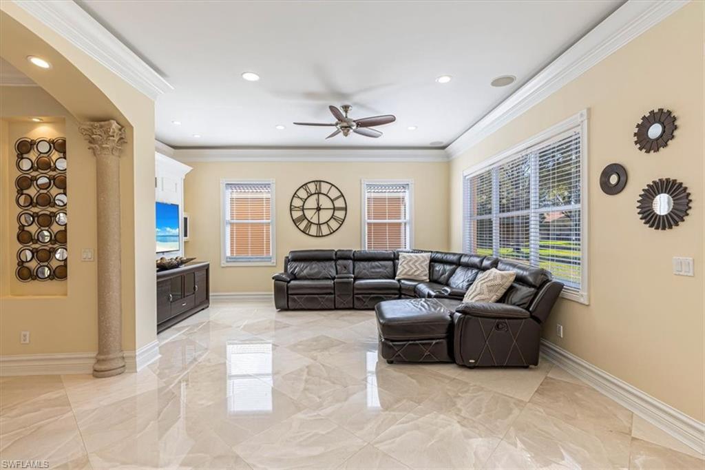 2135 Par Drive Naples, FL 34120 - Photo 7 of 49 a living room with furniture and a large window