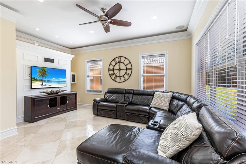 2135 Par Drive Naples, FL 34120 - Photo 8 of 49 a living room with furniture and a flat screen tv