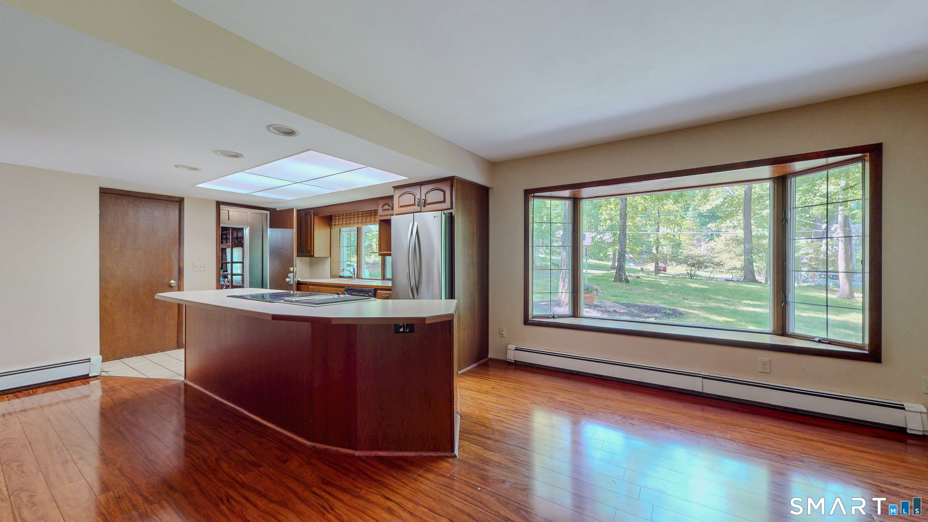 133 Chambers Road Danbury, CT 06811 - Photo 7 of 30 a view of kitchen with granite countertop window and wooden floor