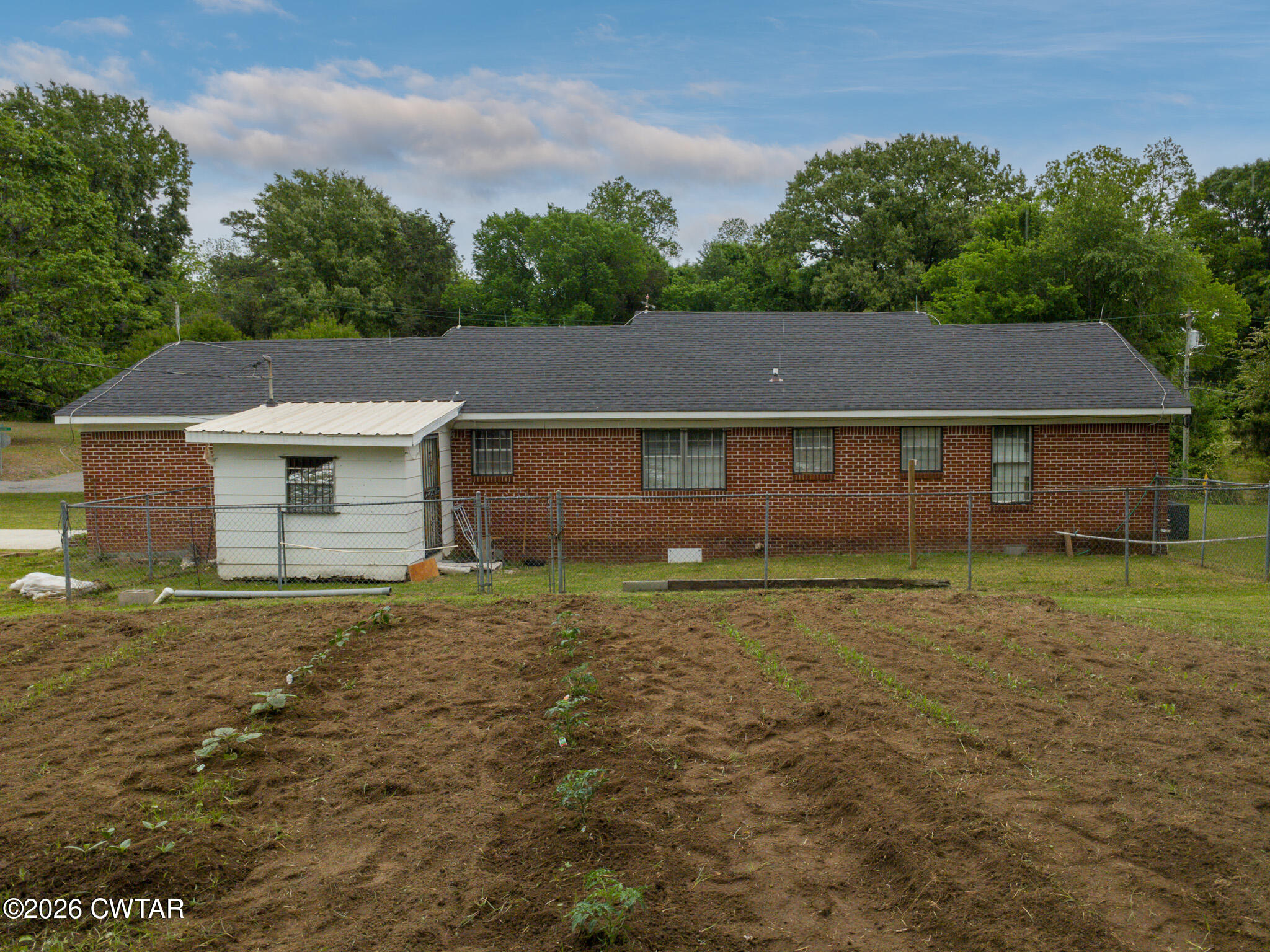 11 North Main Street Stanton, TN 38069 - Photo 16 of 18 a aerial view of a house with a yard and garage