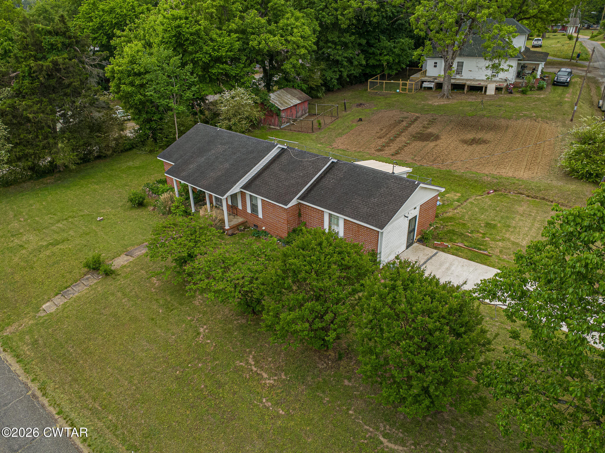 11 North Main Street Stanton, TN 38069 - Photo 17 of 18 an aerial view of a house with garden space and a lake view