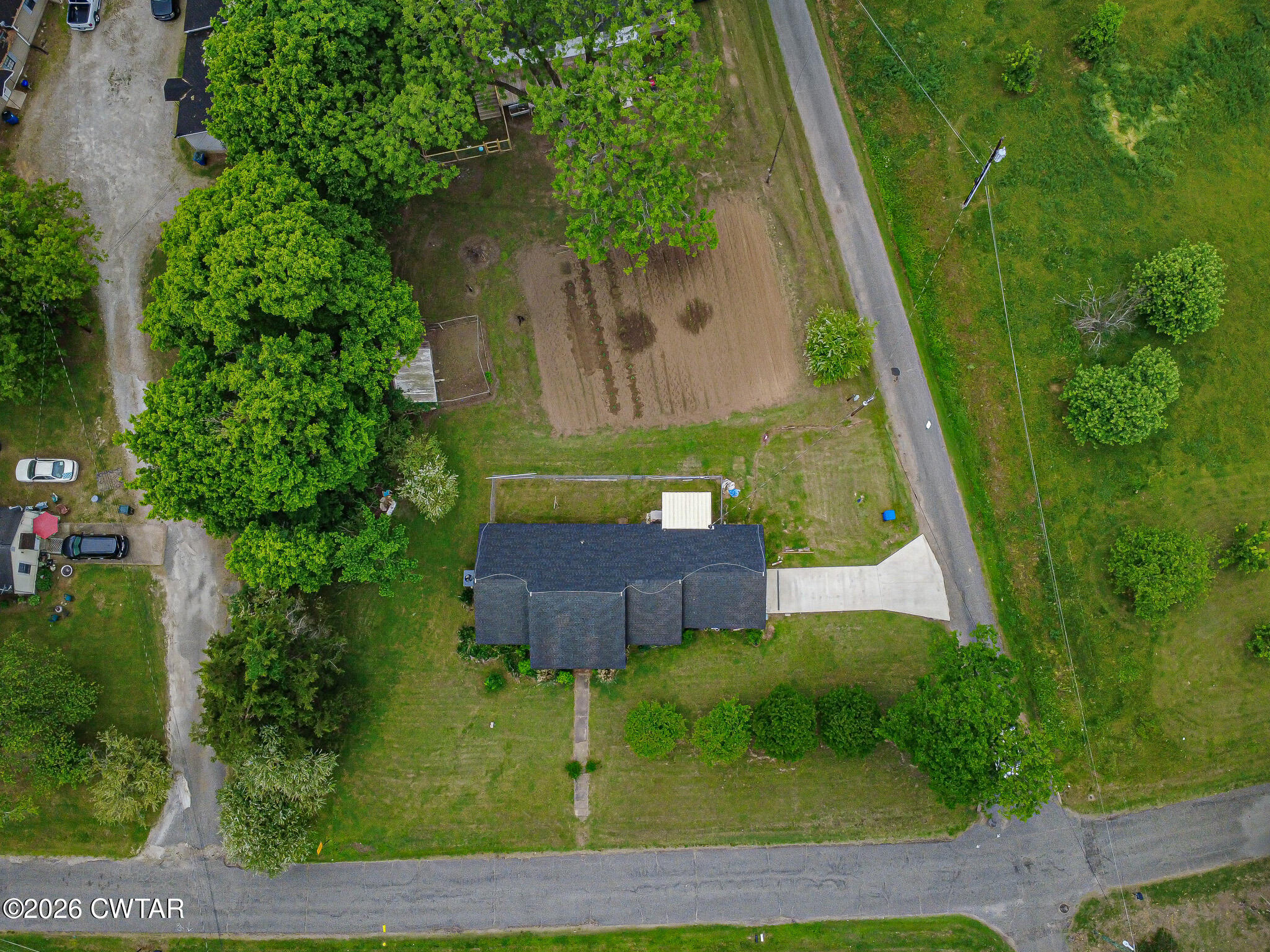 11 North Main Street Stanton, TN 38069 - Photo 18 of 18 a view of backyard with a garden and plants