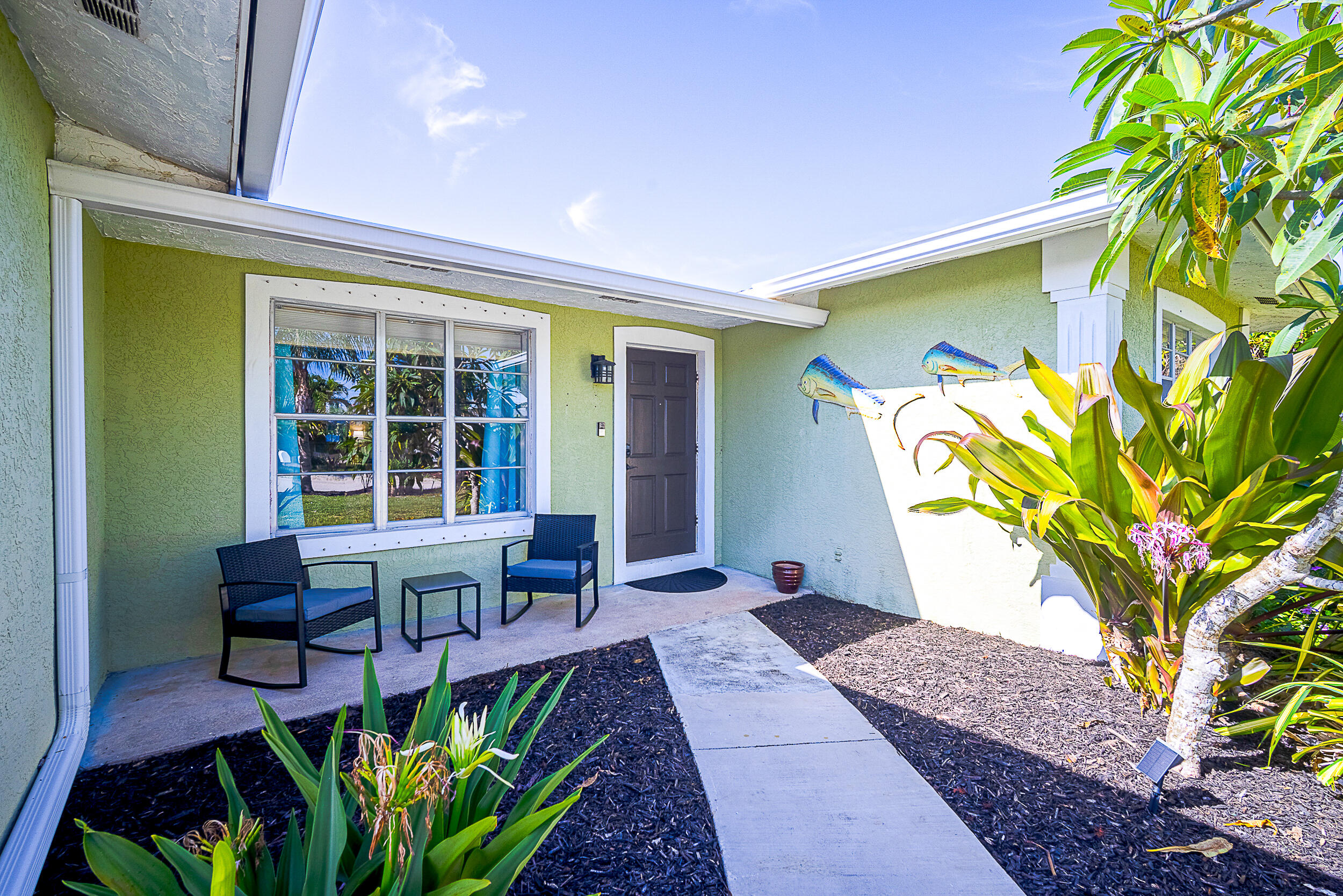 5512 Southeast Nassau Terrace Stuart, FL 34997 - Photo 2 of 24 a house view with a seating space