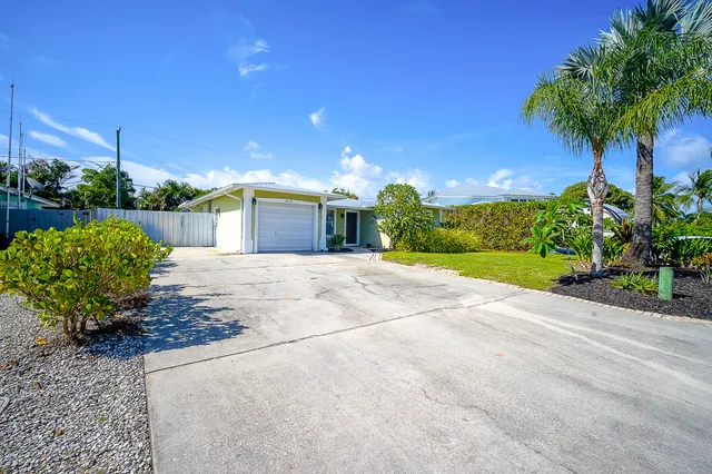 a view of a garden with a house