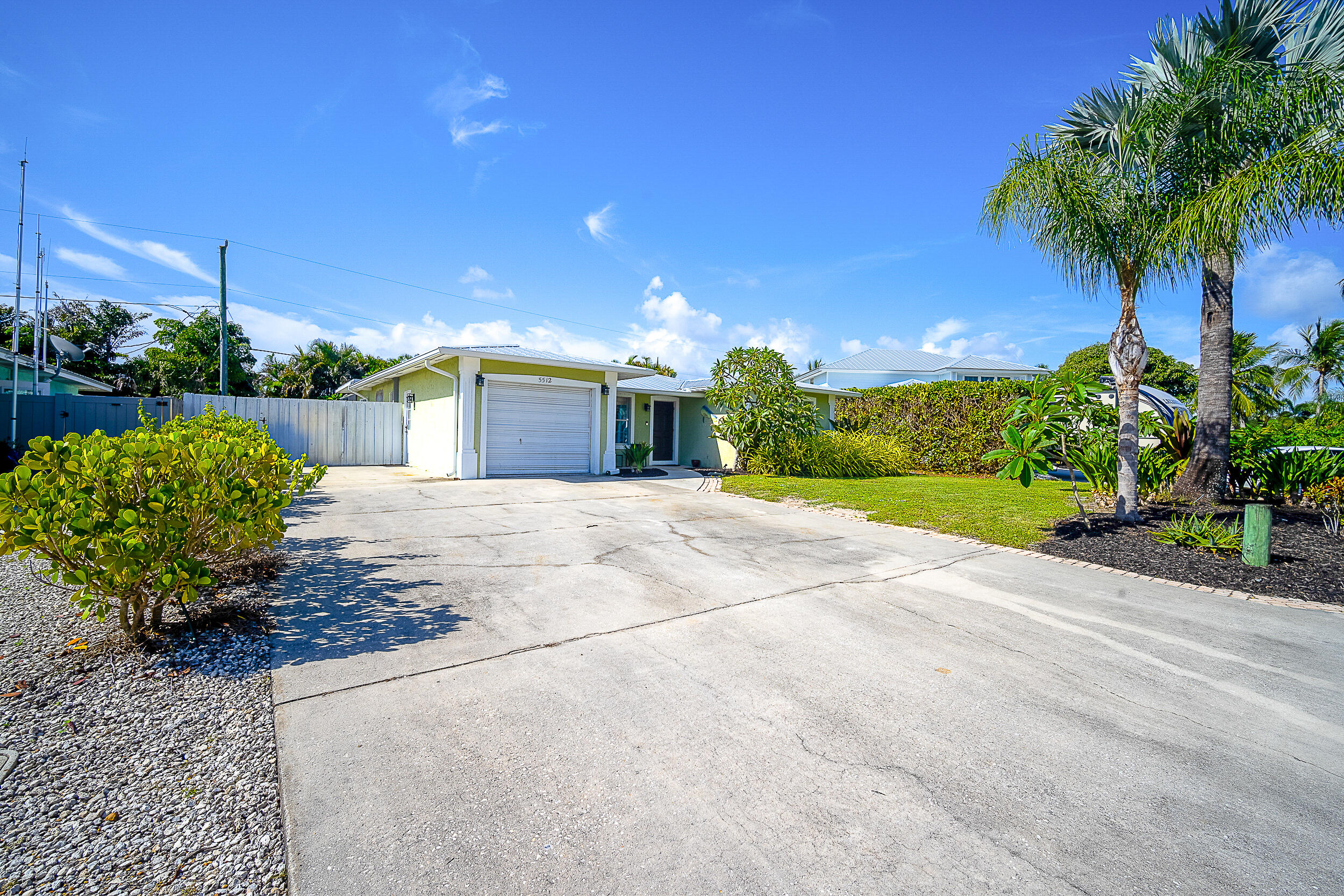 5512 Southeast Nassau Terrace Stuart, FL 34997 - Photo 22 of 24 a view of a garden with a house