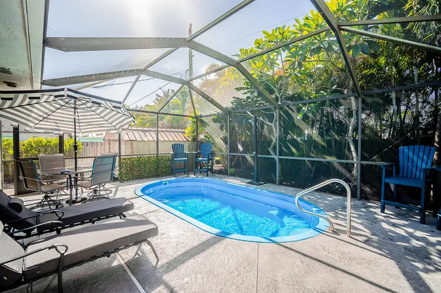 a view of a swimming pool with a patio