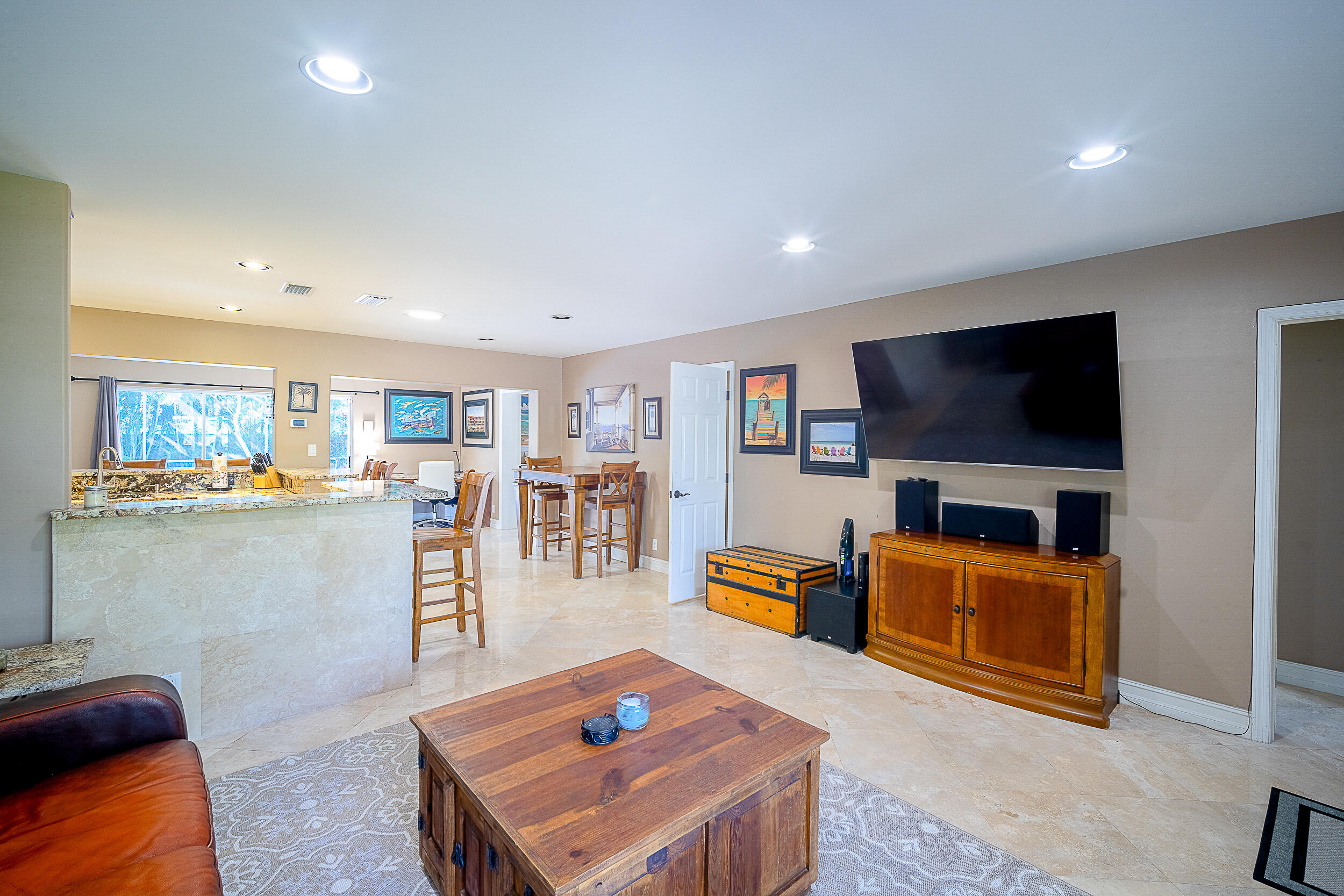 5512 Southeast Nassau Terrace Stuart, FL 34997 - Photo 8 of 24 a living room with furniture and a flat screen tv