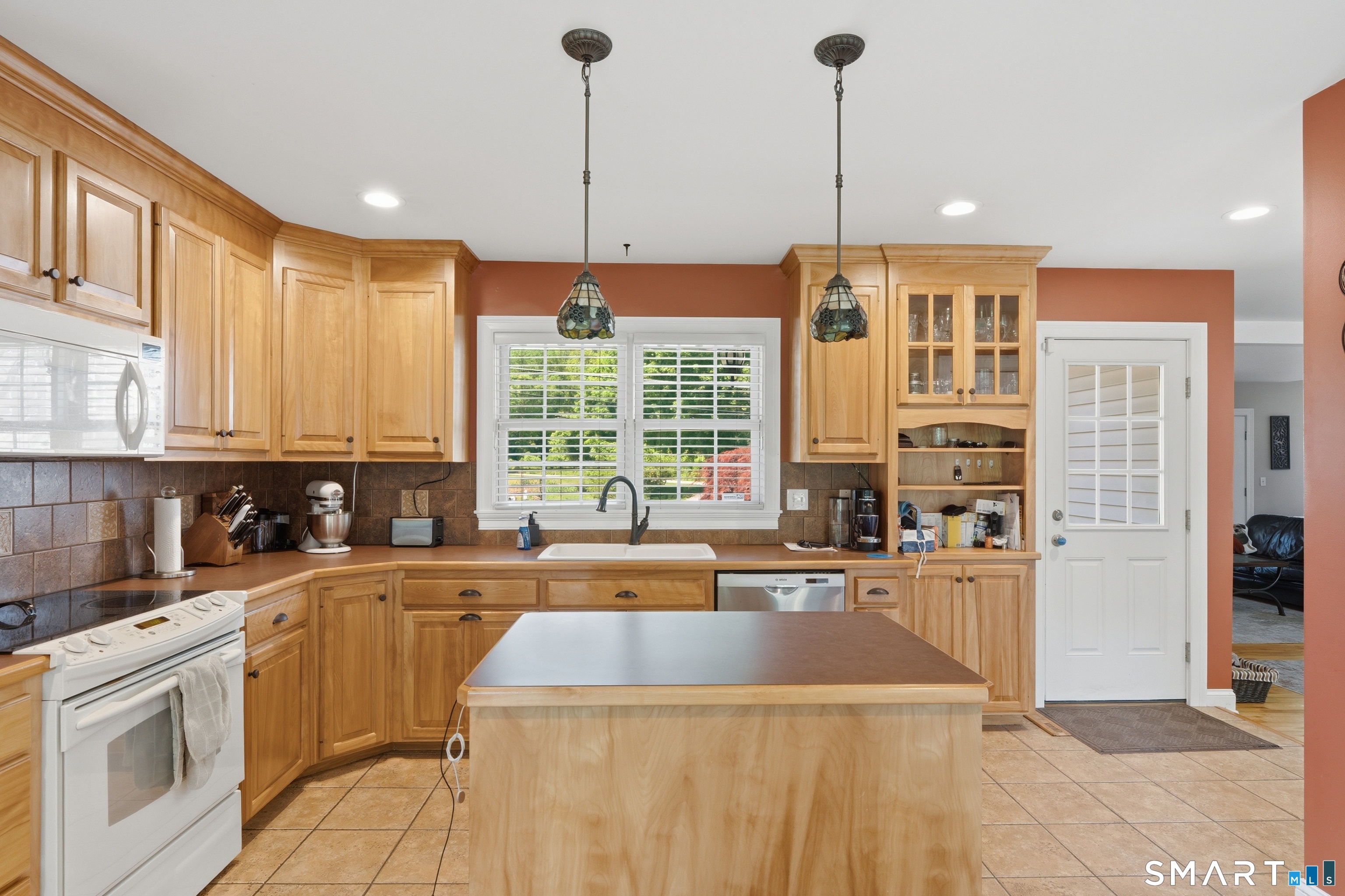 48 Case Road Burlington, CT 06013 - Photo 6 of 39 a kitchen with stainless steel appliances granite countertop a sink a stove and a wooden floors