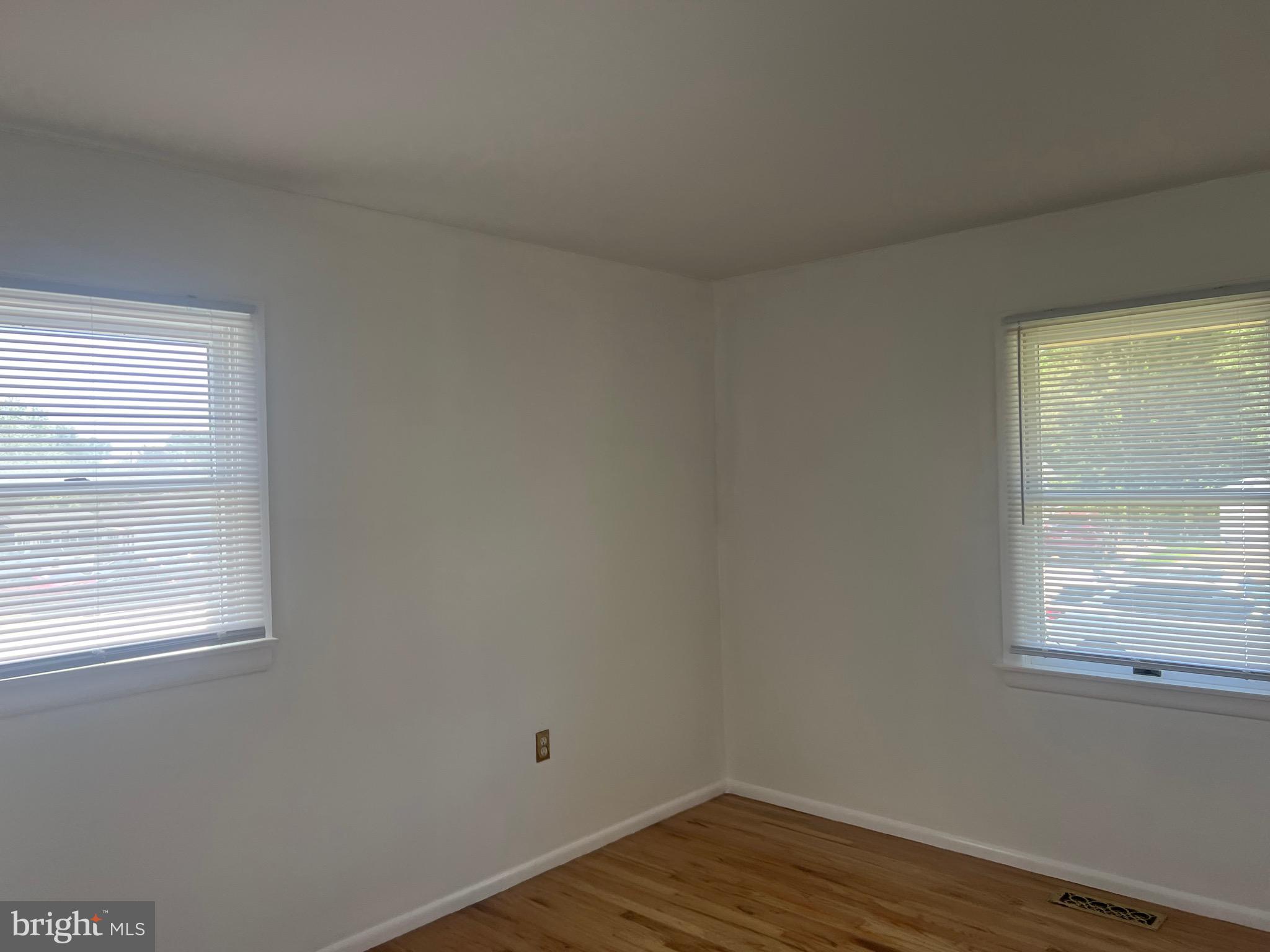 705 Bayberry Road Edgewood, MD 21040 - Photo 15 of 28 a view of an empty room with wooden floor and a window