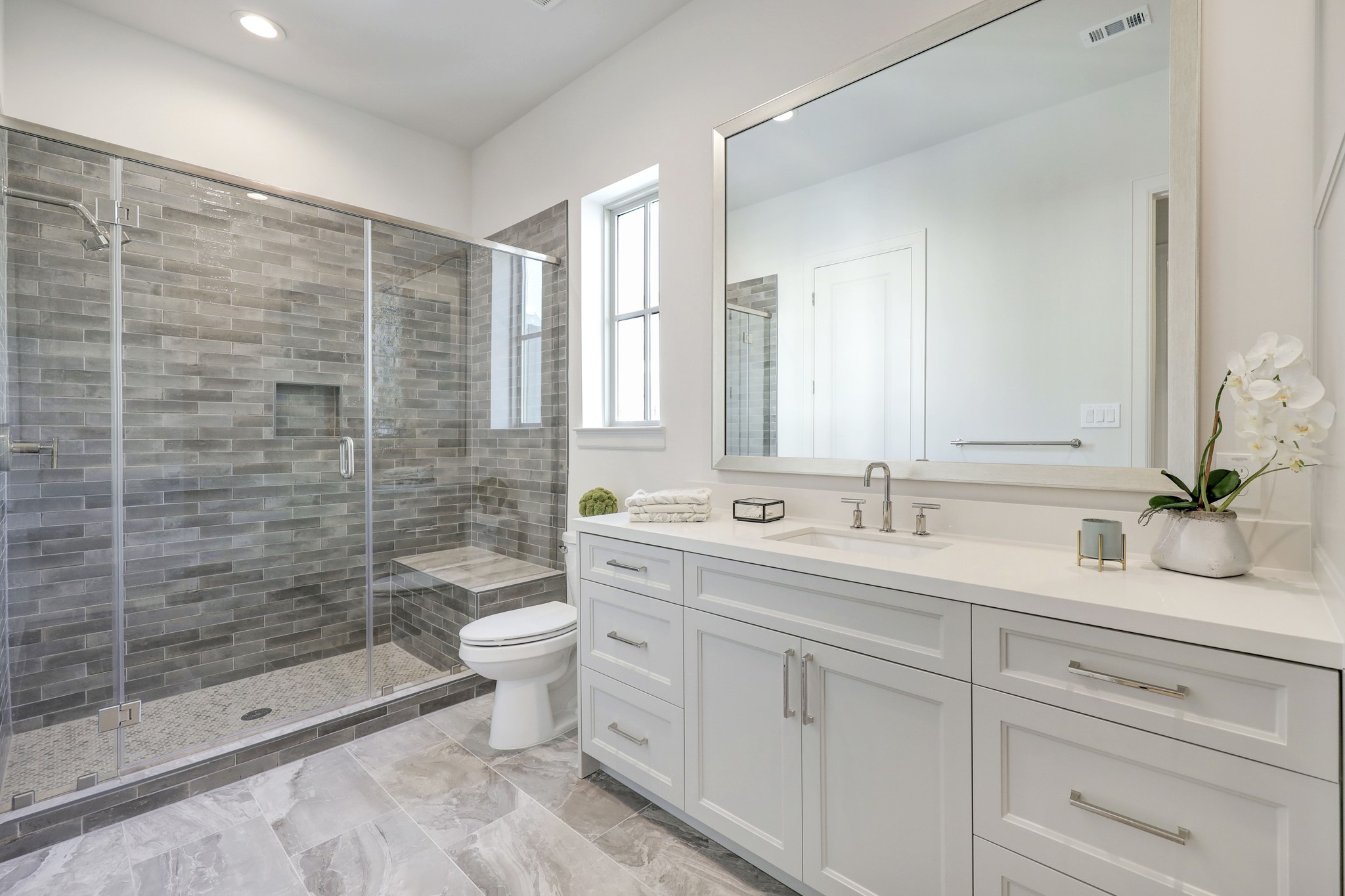 111 Wellington Row Road Houston, TX 77024 - Photo 11 of 19 a bathroom with a double vanity sink toilet and shower